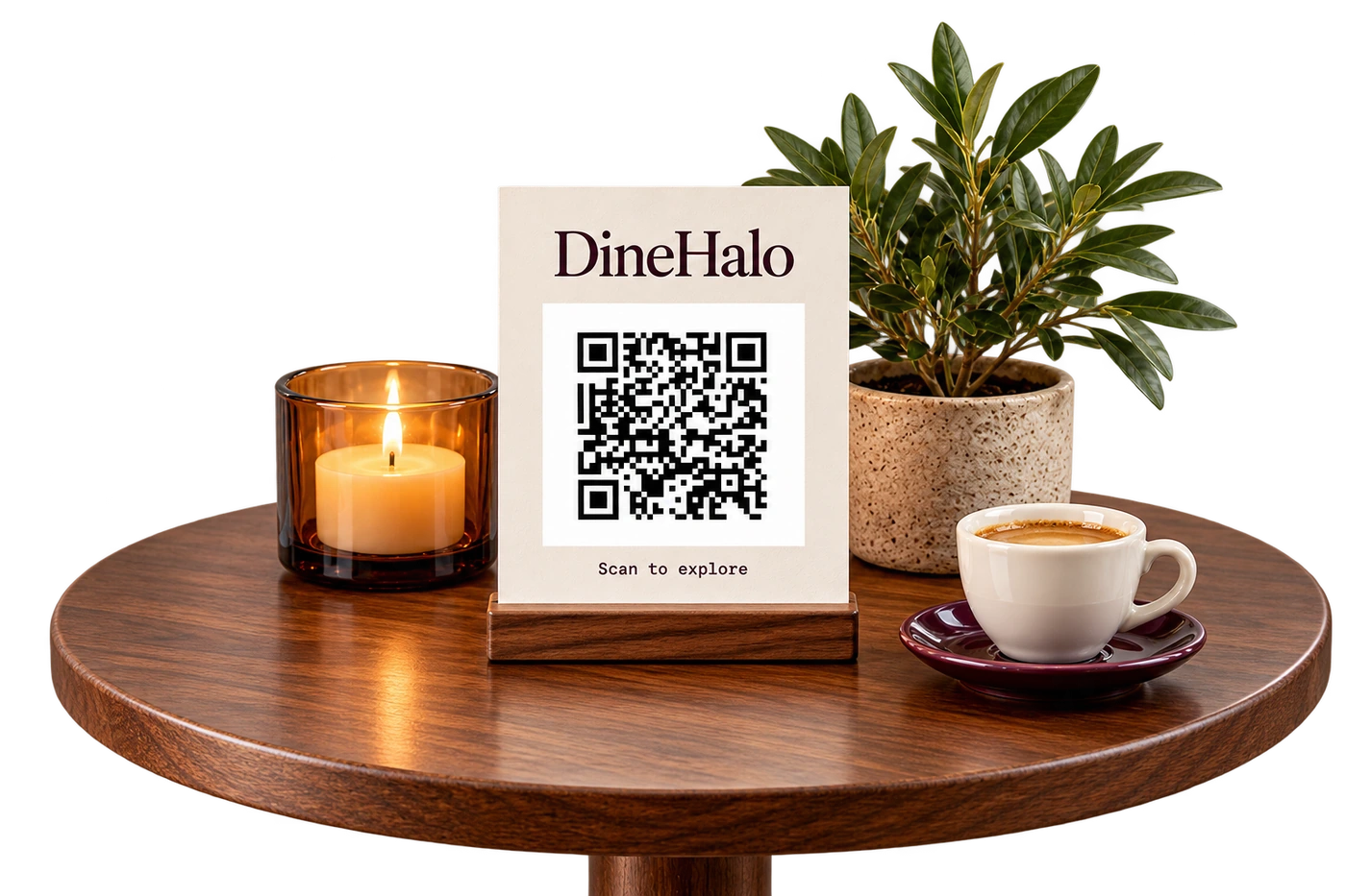 A DineHalo QR card on a walnut café table beside an amber candle glass, leafy plant and cup of tea.